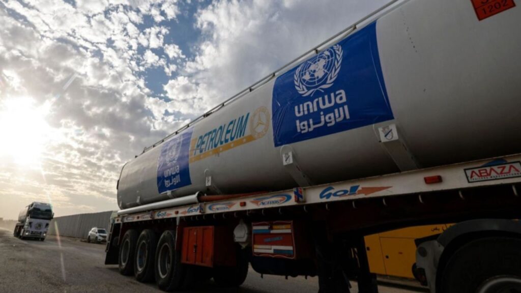 Trucks of the United Nations Relief and Works Agency for Palestine Refugees (UNRWA) carrying fuel arrive at the Egyptian side of the Rafah border crossing with the Gaza Strip on November 22, 2023.