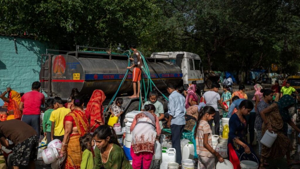 Residents fill water from a water tanker at a slum in New Delhi, India, on Friday, May 19, 2023.