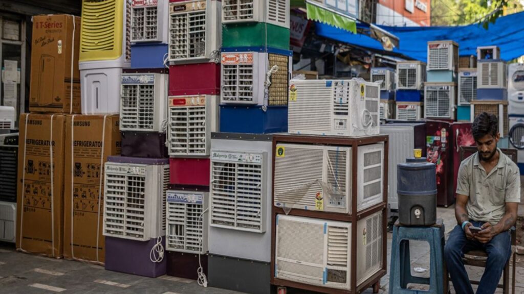 Air-conditioners and air-coolers displayed for sale at a store in New Delhi, India, on Monday, May 8, 2023.