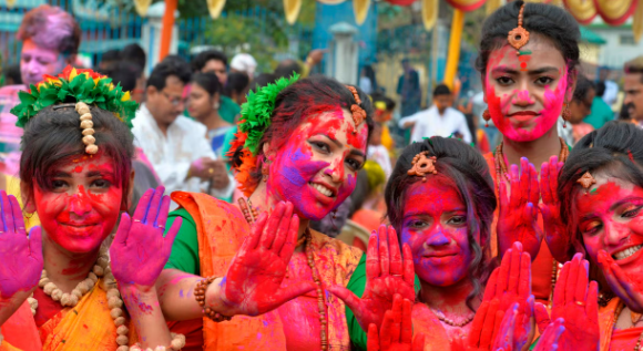 Holi, people of all ages come together to drench each other in vibrant hues of powdered colors and water.